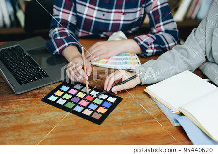 A group of professional web developer and graphic designer working together in the office. 95440620