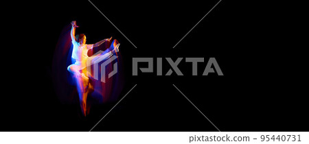 Creative dynamic portrait of athlete, dancer in white sports clothes jumping, flying over dark background in mixed neon light, glow. Art, aspiration, music, fashion Creative dynamic portrait of athlete, dancer in white sports clothes jumping, flying over dark background in mixed neon light, glow. Art, aspiration, music, fashion 95440731