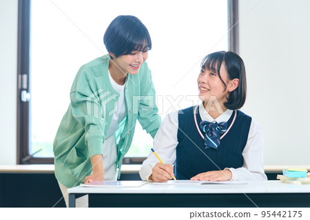 Junior high school students studying, teachers teaching 95442175