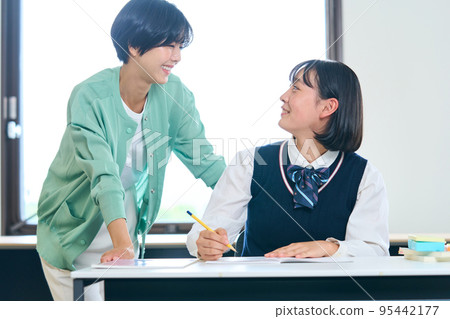 Junior high school students studying, teachers teaching 95442177