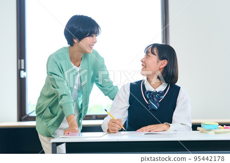 Junior high school students studying, teachers teaching 95442178