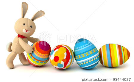 Funny toy rabbit pushes painted Easter eggs 95444027