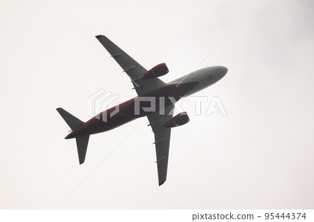 Russian regional jet plane in bright sky Russian regional jet plane in bright sky 95444374