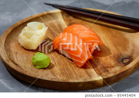 tasty sushi with salmon on a black background 95445404