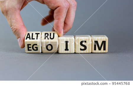 Altruism or egoism symbol. Concept words Egoism and Altruism on wooden cubes. Psychologist hand. Beautiful grey table grey background. Business psychological altruism or egoism concept. Copy space Altruism or egoism symbol. Concept words Egoism and Altruism on wooden cubes. Psychologist hand. Beautiful grey table grey background. Business psychological altruism or egoism concept. Copy space 95445768