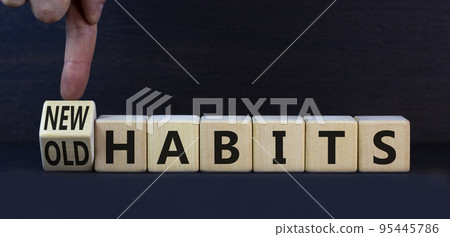 New or old habits symbol. Turned wooden cubes and changed concept words Old habits to New habits. Beautiful grey table grey background. Business old or new habits concept. Copy space. New or old habits symbol. Turned wooden cubes and changed concept words Old habits to New habits. Beautiful grey table grey background. Business old or new habits concept. Copy space. 95445786