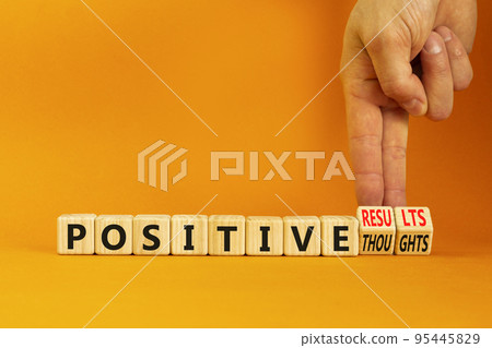 Positive results thought symbol. Concept words Positive results or Positive thoughts on cubes. Businessman hand. Beautiful orange background. Business positive results and thoughts concept. Copy space 95445829