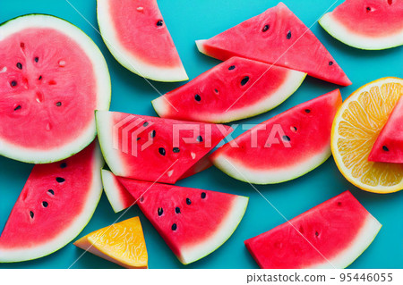 Beautiful pattern with watermelon slices on blue bright background. top view.  95446055