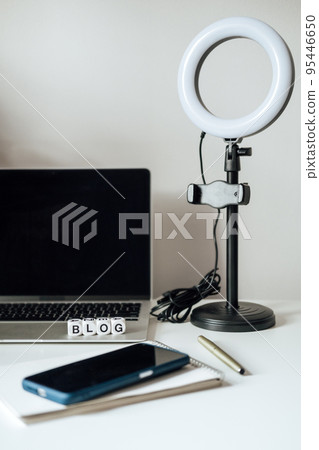 Blogging Equipment. How To Start Blog, Blogging for Beginners. Laptop, Mobile Phone, Ring Light, notebook and glasses on the table 95446650