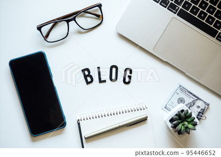 How To Start Blog, Blogging for Beginners. Ways to monetize your blog. Blog word on table with laptop, smartphone, open notebook, dollar banknotes and glasses 95446652