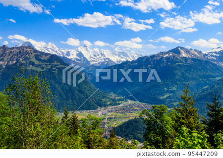 Breathtaking aerial view of Interlaken and Swiss Alps from Harder Kulm viewpoint, Switzerland Breathtaking aerial view of Interlaken and Swiss Alps from Harder Kulm viewpoint, Switzerland 95447209