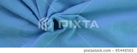 The texture of the fabric in blue color. Material for making shirts and blouses The texture of the fabric in blue color. Material for making shirts and blouses 95448501