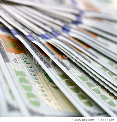 Macro shot with shallow depth of field. Hundred US dollar bills 95448536