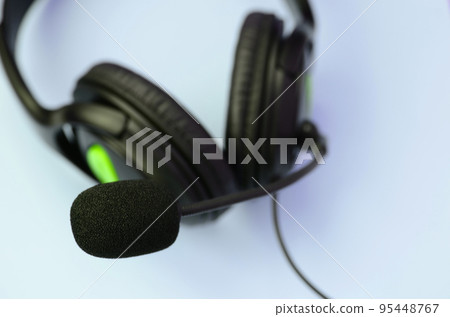 Music listening concept. Black headphones lies on blue background 95448767