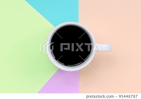 Small white coffee cup on texture background of fashion pastel pink, blue, coral and lime colors paper Small white coffee cup on texture background of fashion pastel pink, blue, coral and lime colors paper 95448787
