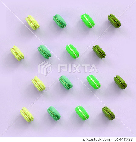 Dessert cake macaron or macaroon on trendy pastel lilac background top view Dessert cake macaron or macaroon on trendy pastel lilac background top view 95448788