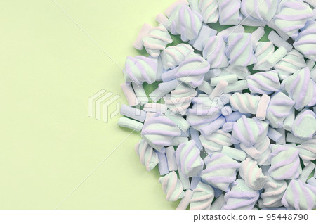 Colorful marshmallow laid out on lime paper background. pastel creative texture Colorful marshmallow laid out on lime paper background. pastel creative texture 95448790
