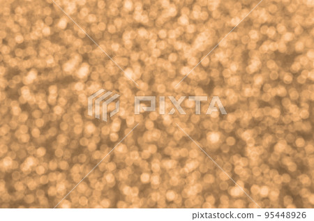 Blurred orange decorative sequins. Background image with shiny bokeh lights from small elements Blurred orange decorative sequins. Background image with shiny bokeh lights from small elements 95448926