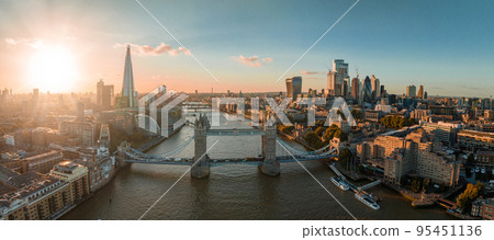Aerial view of the London Tower Bridge at sunset. Sunset with beautiful clouds over London - the capital of Britain. Aerial view of the London Tower Bridge at sunset. Sunset with beautiful clouds over London - the capital of Britain. 95451136