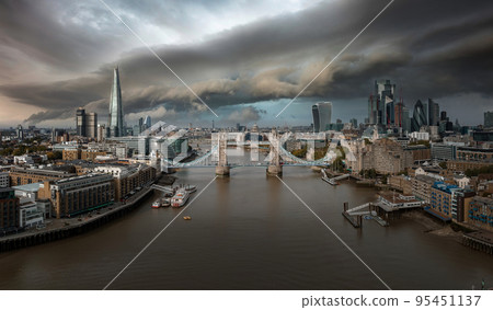 Aerial view of the Tower bridge, central London, from the South bank of the Thames. Iconic symbol of London. Aerial view of the Tower bridge, central London, from the South bank of the Thames. Iconic symbol of London. 95451137