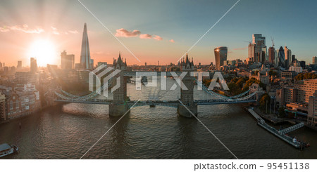 Aerial view of the London Tower Bridge at sunset. Sunset with beautiful clouds over London - the capital of Britain. Aerial view of the London Tower Bridge at sunset. Sunset with beautiful clouds over London - the capital of Britain. 95451138