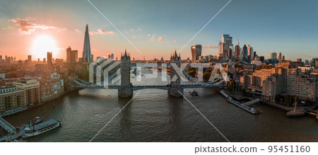 Aerial view of the London Tower Bridge at sunset. Sunset with beautiful clouds over London - the capital of Britain. Aerial view of the London Tower Bridge at sunset. Sunset with beautiful clouds over London - the capital of Britain. 95451160