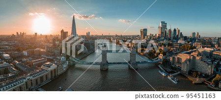 Aerial view of the London Tower Bridge at sunset. Sunset with beautiful clouds over London - the capital of Britain. 95451163