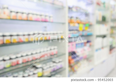 Pharmacy drugstore blur abstract background with medicine and vitamin product on shelves 95452003