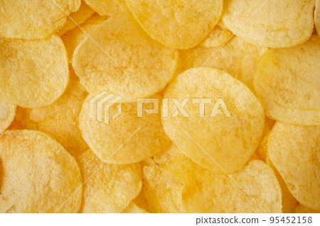 crispy potato chips snack texture background top view crispy potato chips snack texture background top view 95452158