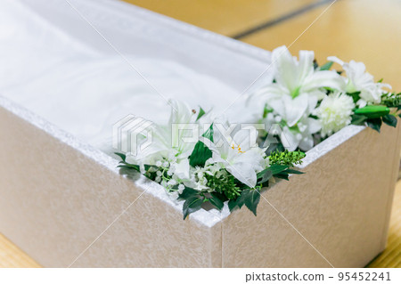 funeral coffin and flowers 95452241