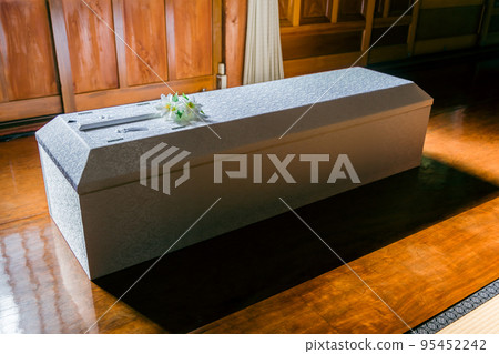 funeral coffin and flowers 95452242