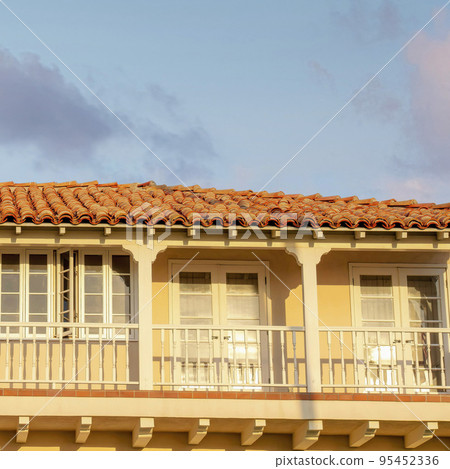 Square Puffy clouds at sunset Terrace of a mediterranean style house with US flag at La Jolla, 95452336