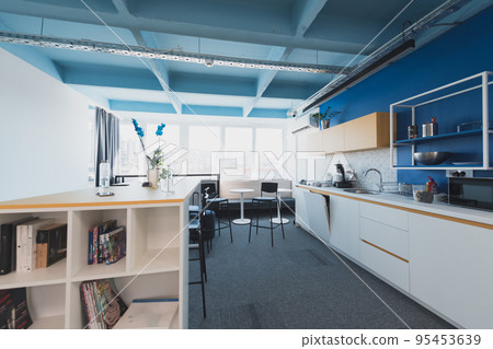 Interior of cozy light boardroom with table, modern stylish chairs and desktop computer, all ready for corporate meeting. Empty spacious office of business company or creative coworking space. Interior of cozy light boardroom with table, modern stylish chairs and desktop computer, all ready for corporate meeting. Empty spacious office of business company or creative coworking space. 95453639