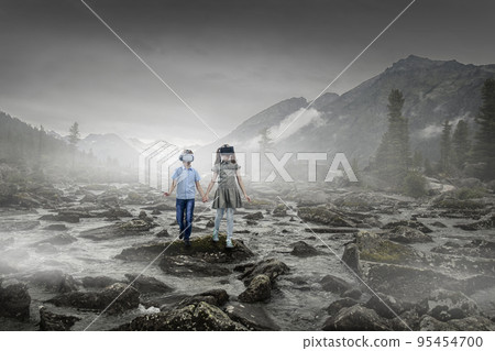 Kids wearing virtual reality goggles 95454700