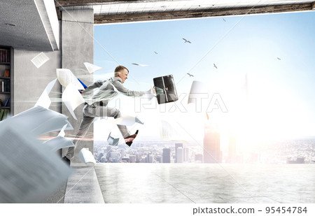 Portrait of energetic businessman jumping in open air Portrait of energetic businessman jumping in open air 95454784
