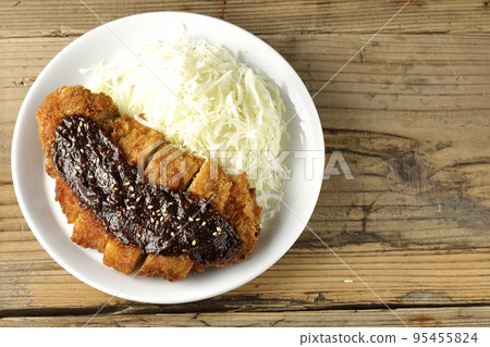 Bird's-eye view of pork cutlet with shredded cabbage and miso-based sauce 95455824