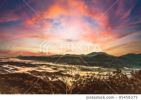 Sea of the mist with colorful brown,orange sky on mountain at morning sunrise background Sea of the mist with colorful brown,orange sky on mountain at morning sunrise background 95456375