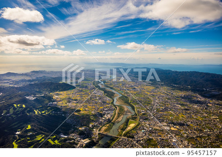 Aerial view of Iwade City and Wakayama City from above Yuriyama in Kinokawa City, Wakayama Prefecture from a paraglider. sunny autumn october 95457157