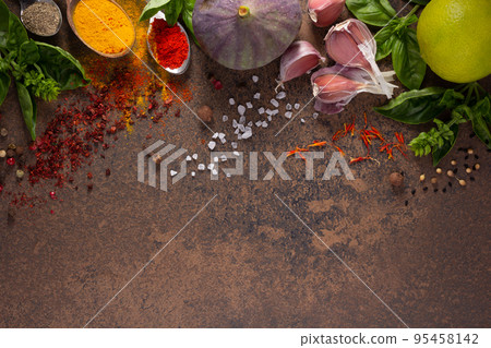 Variety of spices and herbs at table background. Cooking concept and ingredients 95458142