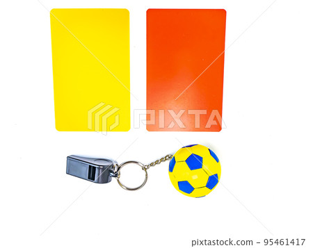 Soccer ball and referee whistle with cards on a white background. 95461417