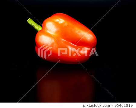 Vegetable red bell pepper on a black background. Vegetable red bell pepper on a black background. 95461819