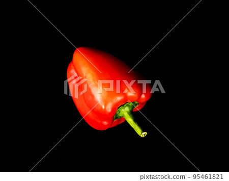 Vegetable red bell pepper on a black background. Vegetable red bell pepper on a black background. 95461821