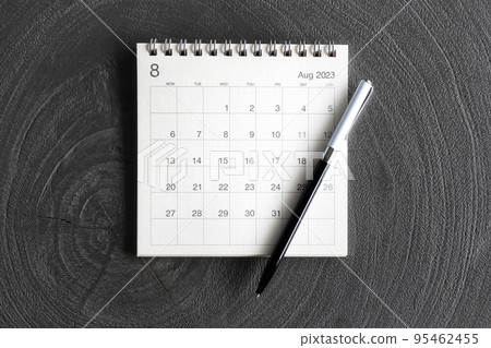 Calendar 2023 with pen on rustic black background, top view Calendar 2023 with pen on rustic black background, top view 95462455