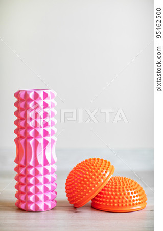 pink massage roller for neck, shoulders and back and orange foot massager. pink massage roller for neck, shoulders and back and orange foot massager. 95462500