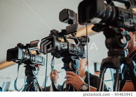 professional video production camera recording live event on stage. television social media broadcasting seminar conference. 95463941
