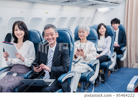 Passengers traveling by plane 95464222