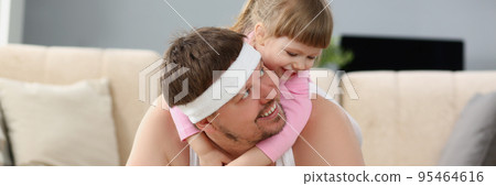 Father and daughter have fun playing together, physical exercise with kid on back 95464616