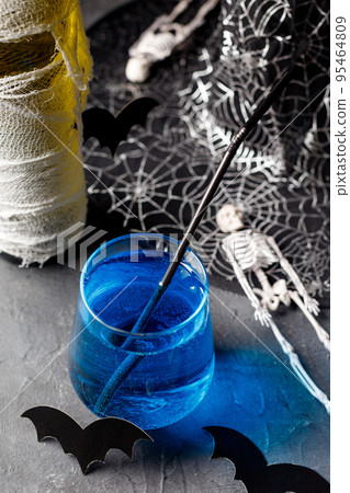 Blue cocktail for halloween party in glass Blue cocktail for halloween party in glass 95464809