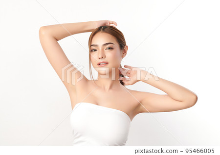 Beautiful Young Asian woman lifting hands up to show off clean and hygienic armpits or underarms on white background, Smooth armpit cleanliness and protection concept 95466005