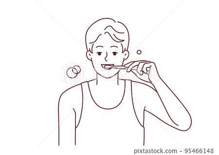 Smiling man brushing teeth in morning  95466148